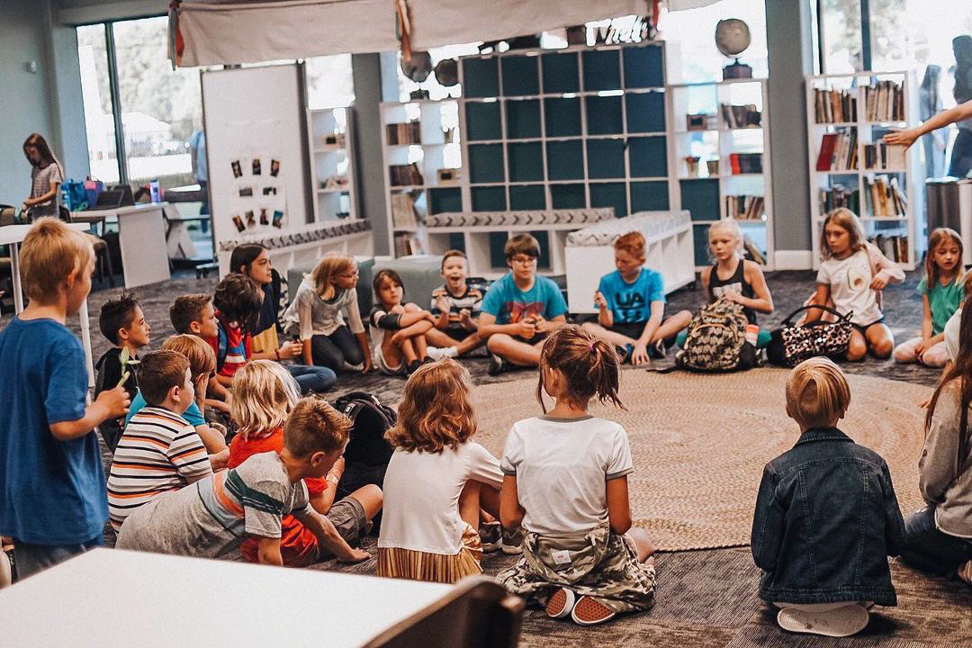 Learners in circle discussion in Acton studio