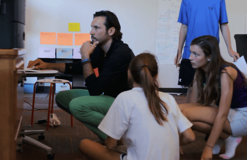 Guide and learners in discussion